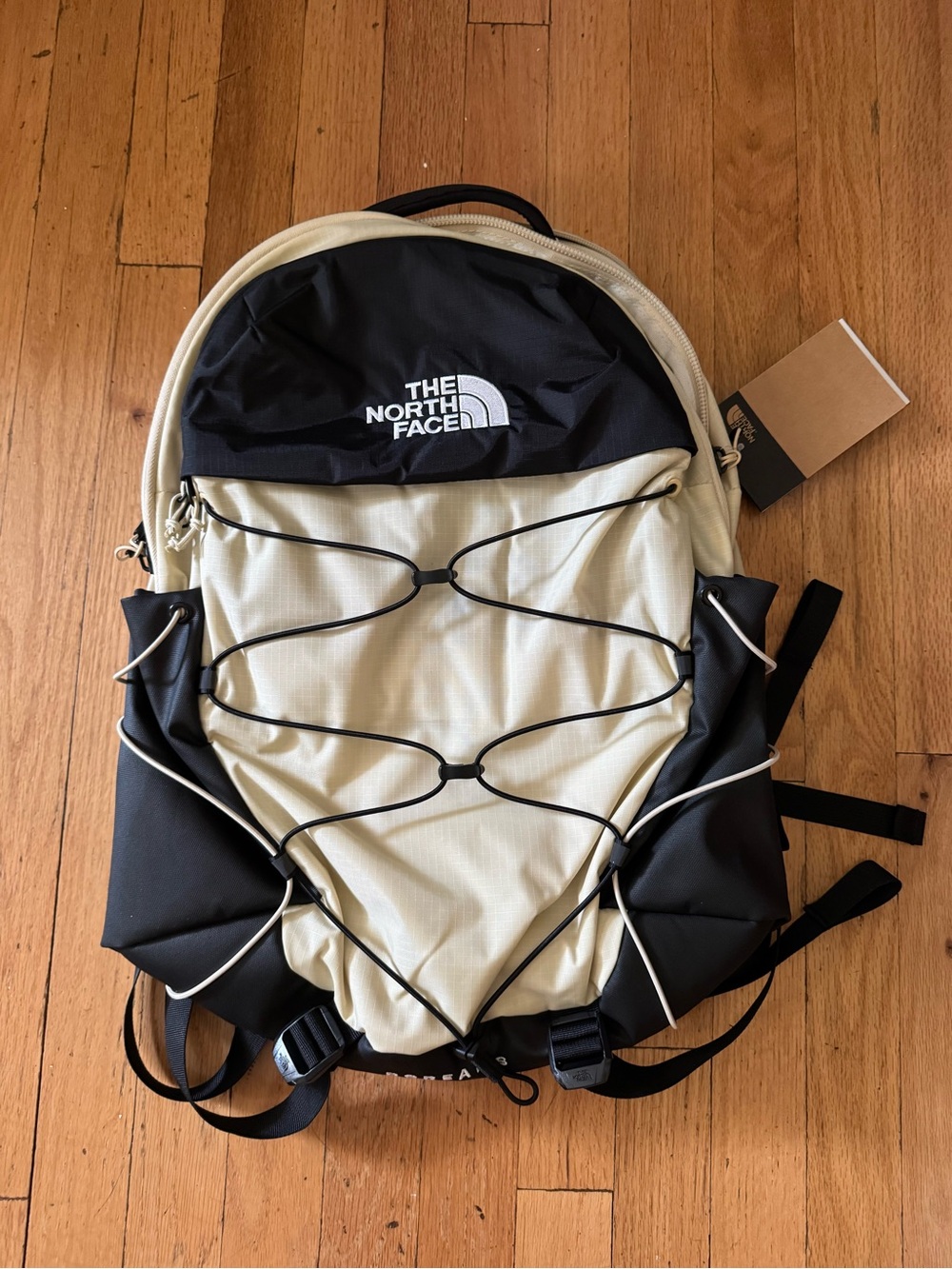 The North Face Two-Tone Black and Cream Borealis Backpack with Bungee Front